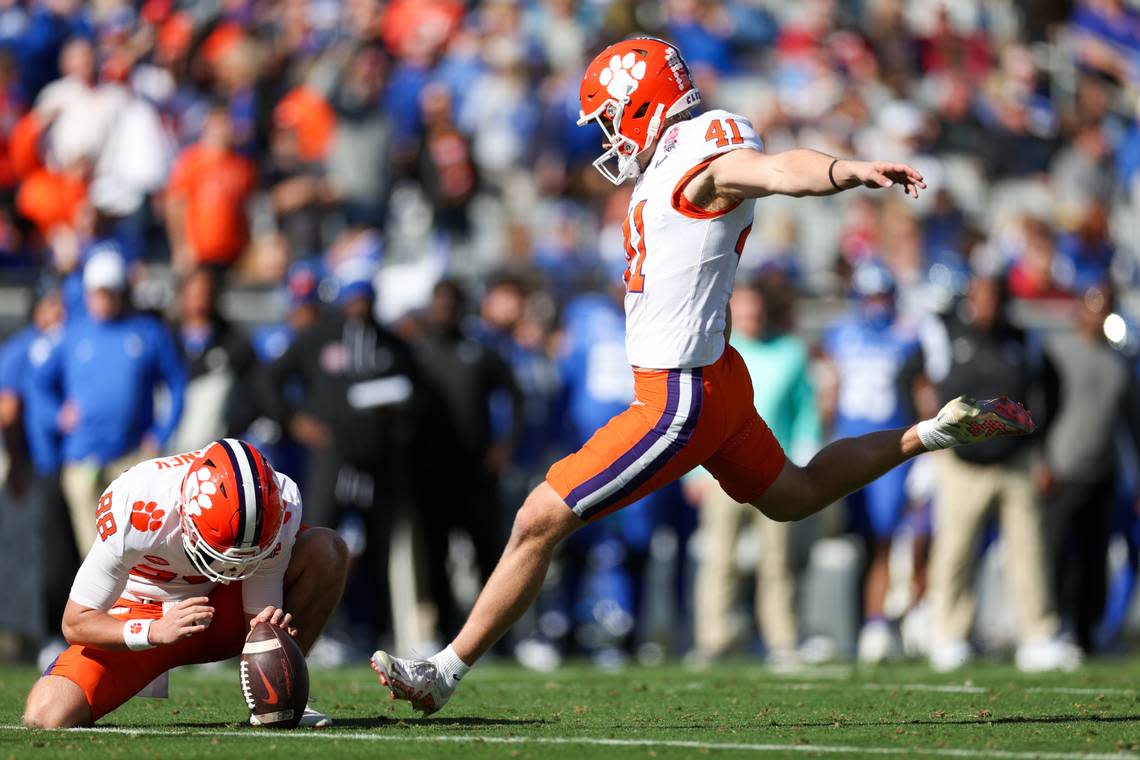 Dec 29, 2023; Jacksonville, FL, USA; Clemson Tigers place kicker Jonathan Weitz (41) attempts a field goal held by wide receiver Clay Swinney (88) against the Kentucky Wildcats in the second quarter during the Gator Bowl at EverBank Stadium.