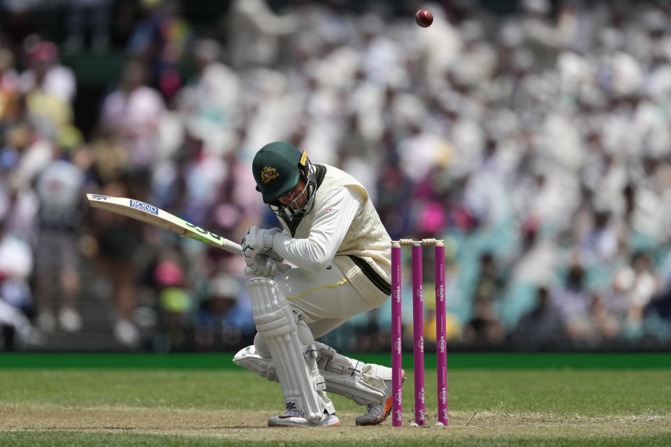 Australia's Usman Khawaja ducks a bouncer from South Africa's Kagiso Rabada during the second day of their cricket test match at the Sydney Cricket Ground in Sydney, Thursday, Jan. 5, 2023. (AP Photo/Rick Rycroft)