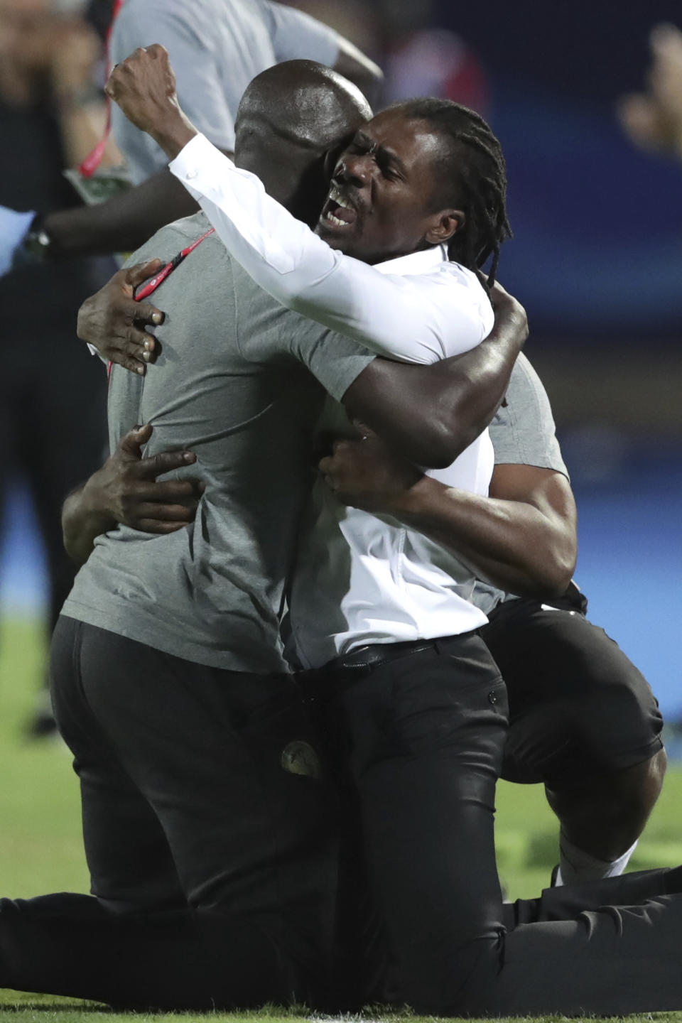 Senegal's head coach Aliou Cisse celebrates end of the African Cup of Nations semifinal soccer match between Senegal and Tunisia in 30 June stadium in Cairo, Egypt, Sunday, July 14, 2019. (AP Photo/Hassan Ammar)