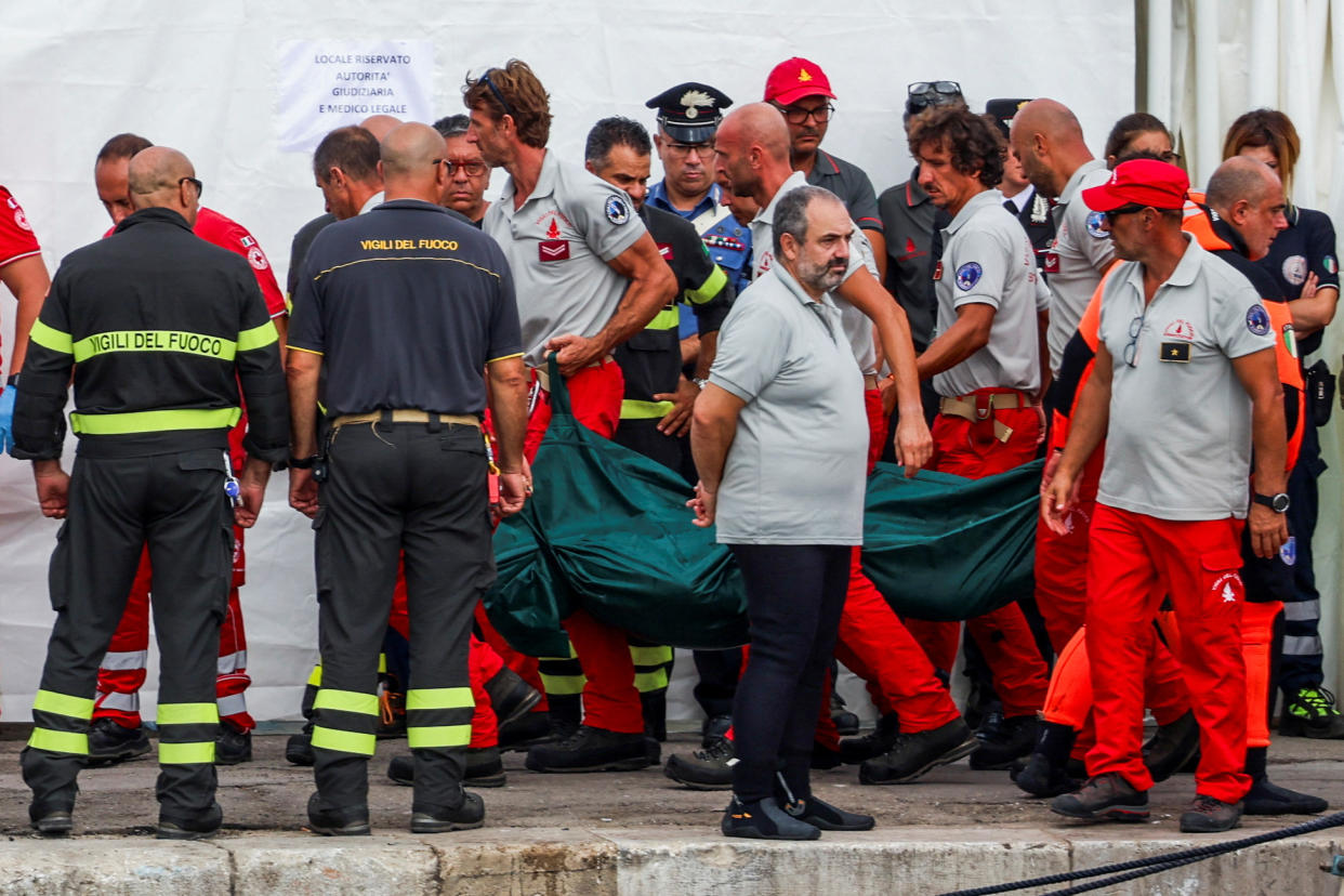 Rescue personnel transport a body after a luxury yacht, which was carrying British entrepreneur Mike Lynch, sank off the coast of Porticello, near the Sicilian city of Palermo, Italy, August 21, 2024. REUTERS/Louiza Vradi