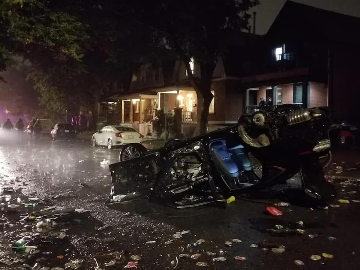 A vehicle was flipped by partygoers after last year's Panda Game. Officials are warning any issues this year could spell the end of the annual football match. (Steve Higham - image credit)