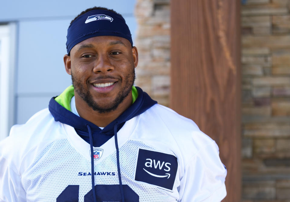 Seattle Seahawks linebacker Uchenna Nwosu smiles after a press availability to discuss signing a three-year contract extension with $32 million guaranteed, before the NFL football team's training camp, Wednesday, July 26, 2023, in Renton, Wash. (AP Photo/Lindsey Wasson)