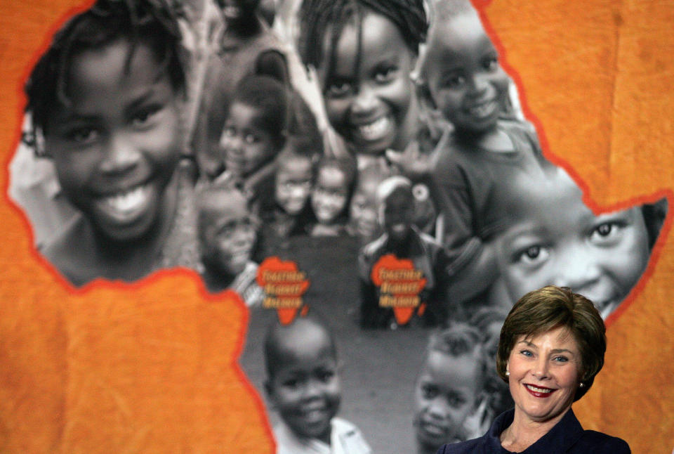 FILE - In this June 27, 2007, file photo, U.S. first lady Laura Bush, looks on in Maputo, Mozambique, after announcing $507 million in assistance would be approved for Mozambique to build roads and boost its battle with malaria, which kills about 150 Mozambicans each day. When Melania Trump flies to Africa next week on her first extended international journey without the president, she’ll be following in the footsteps of her recent predecessors. (AP Photo/Themba Hadebe, File)