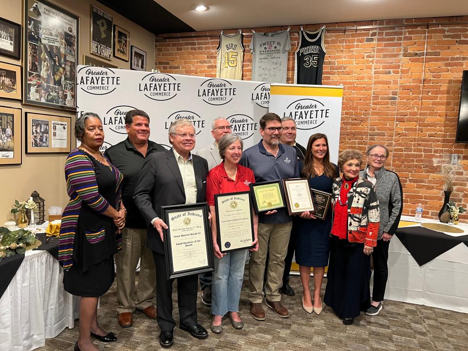 Janet and Jerry Lecy, center, owners of Great Harvest Bread Co., celebrate their Greater Lafayette Commerce award for Small Business of the Month. The bakery won for the month of March 2022.
