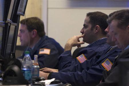 Traders work on the floor of the New York Stock Exchange January 24, 2014. REUTERS/Brendan McDermid