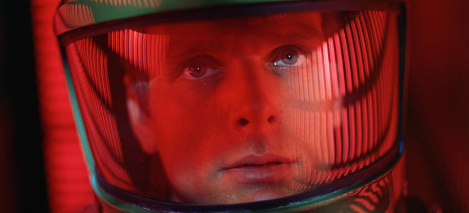 Man in a space helmet with a reflective visor, intense expression, from the film "2001: A Space Odyssey"