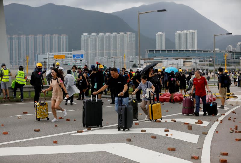 Pictures of the Year: Hong Kong protest tide turns into sea of flames