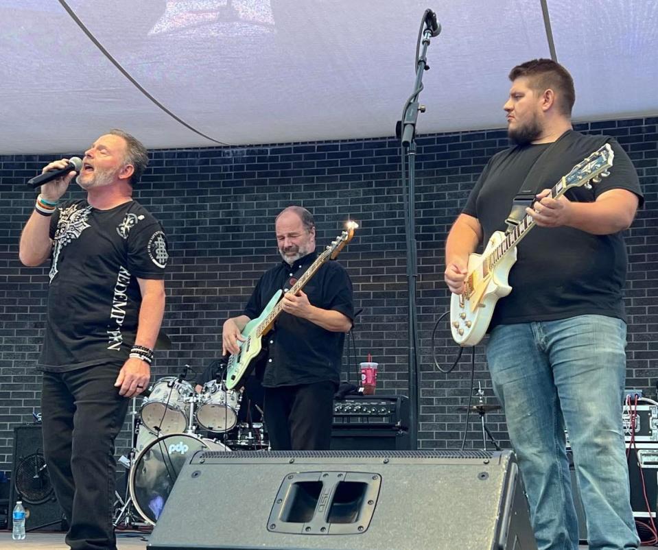 ZYGRT, a tribute band, performs Friday night at Centennial Plaza during the Downtown Canton Music Fest. The band plays Led Zeppelin, Yes, Genesis, Rush and Toto songs.