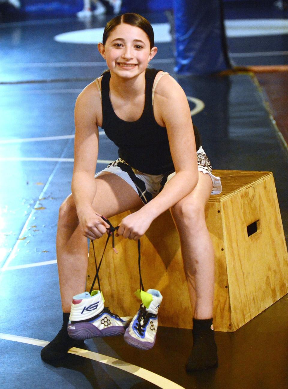 New England Wrestling champion Zsofia Quiles, 11, of Norwich, works out at MarcAurele Wrestling in Niantic.