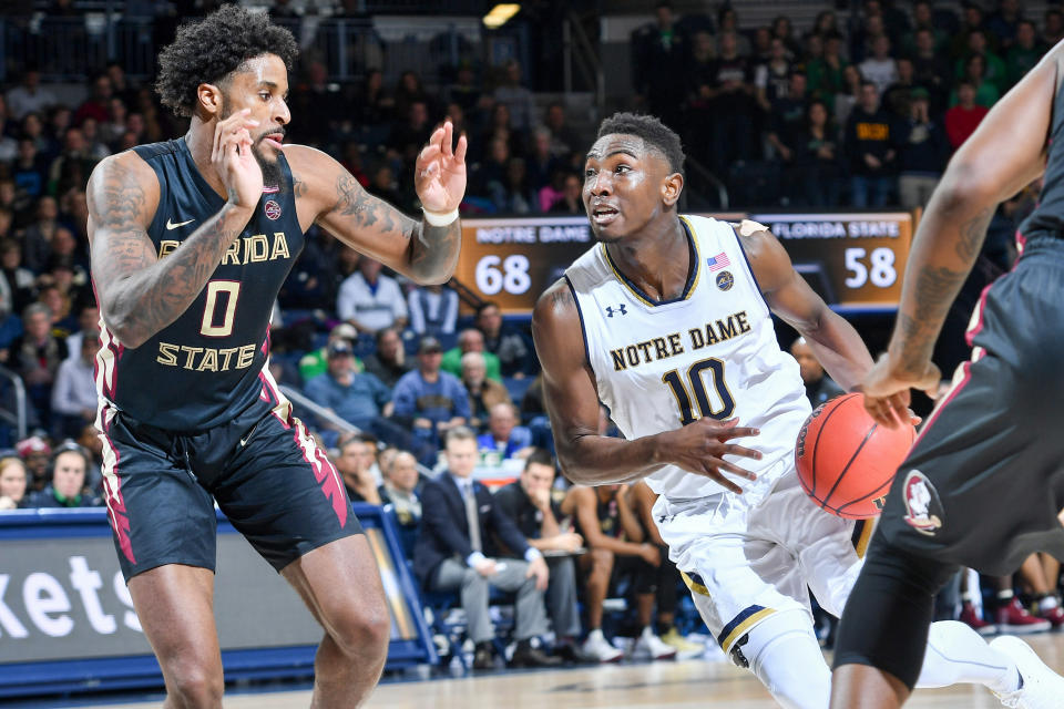 Feb 10, 2018; South Bend, IN, USA; Notre Dame Fighting Irish guard T.J. Gibbs (10) drives to the basket as Florida State Seminoles forward Phil Cofer (0) defends in the second half at the Purcell Pavilion. Matt Cashore-USA TODAY Sports