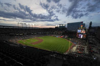 A crowd watches the fifth inning of a baseball game between the Baltimore Orioles and the Toronto Blue Jays, Friday, June 18, 2021, in Baltimore. (AP Photo/Julio Cortez)