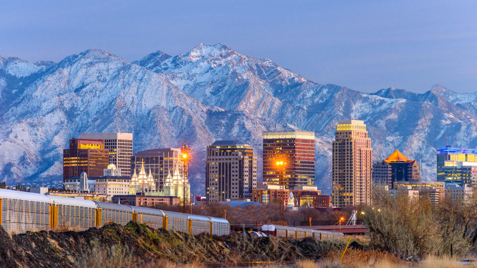 Salt lake City downtown and snow capped mountain.