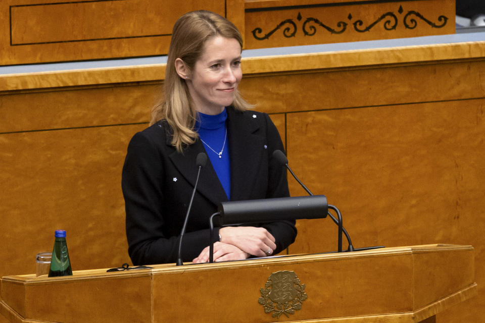 Newly appointed Estonian Prime Minister Kaja Kallas speaks at the Estonian Parliament, in Tallinn, Estonia, Tuesday, Jan. 26, 2021. Estonia’s new two-party coalition government has been sworn in with the first female prime minister since the Baltic country regained independence in 1991. The 15-member Cabinet of Prime Minister Kaja Kallas — a 43-year-old lawyer and a former European Parliament lawmaker — was approved Tuesday in the 101-seat Riigikogu legislature. (AP Photo/Raul Mee)