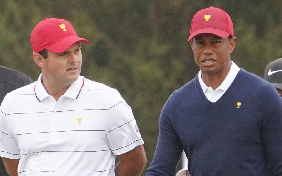 Tiger Woods has backed team-mate Patrick Reed to deal with the mounting pressure - REX