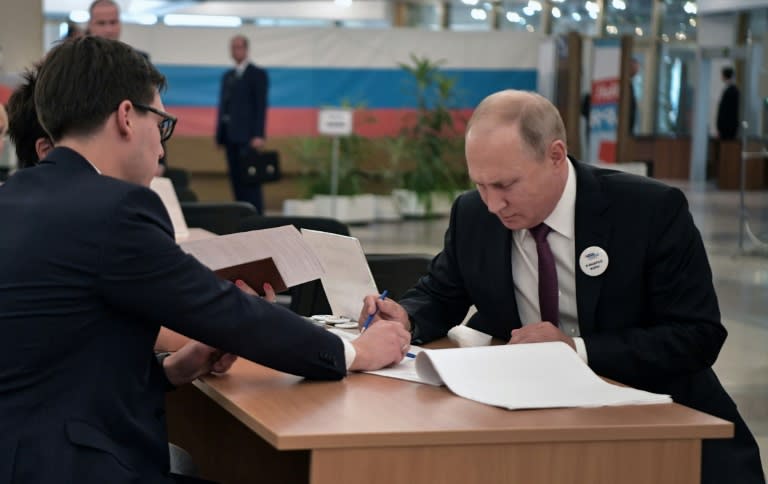 Putin (R) had endorsed the ruling party's candidate in the vote