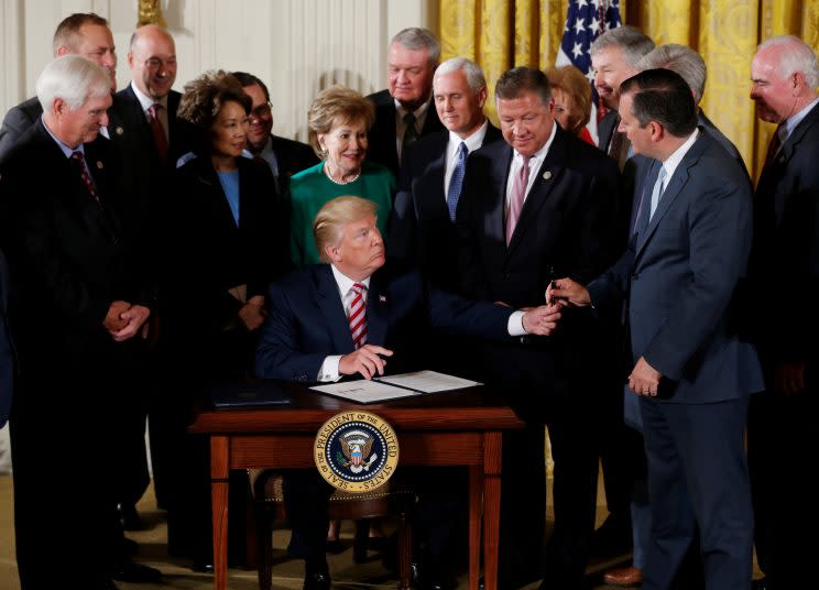 President Trump and guests after signing the air traffic control initiative