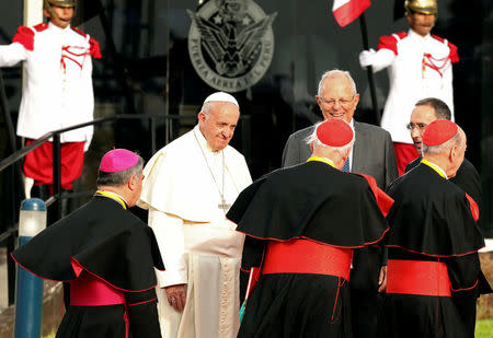 Pope Francis and Peru's President Pedro Pablo Kuczynski greet members of the clergy, in Lima, Peru January 18, 2018. REUTERS/Mariana Bazo