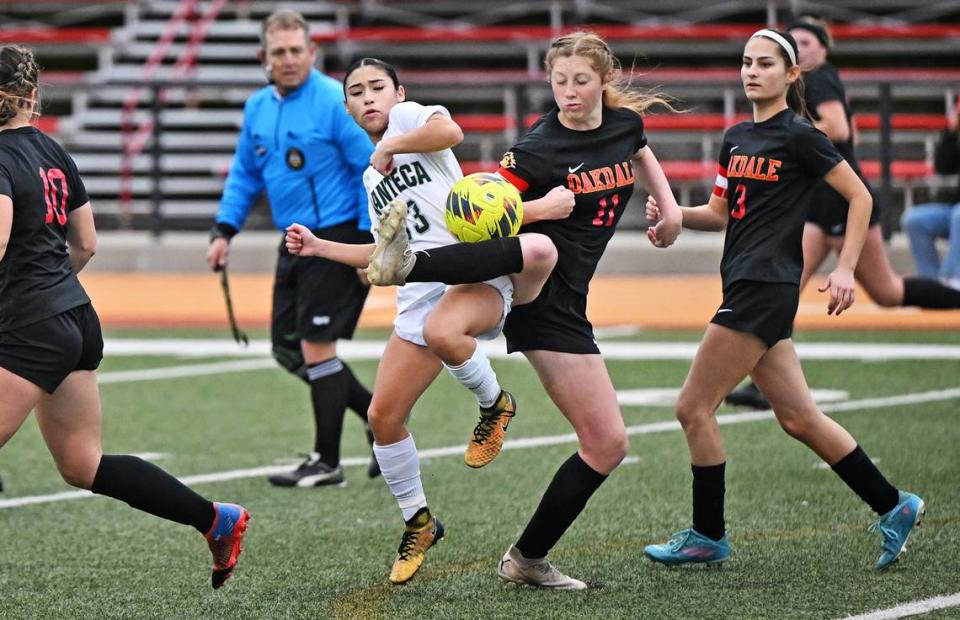 Oakdale’s Claire McGee Brown and Manteca’s Kailee Jackson clash during the Sac-Joaquin Section Division III semifinal game in Oakdale, Calif., Friday, Feb. 16, 2024.