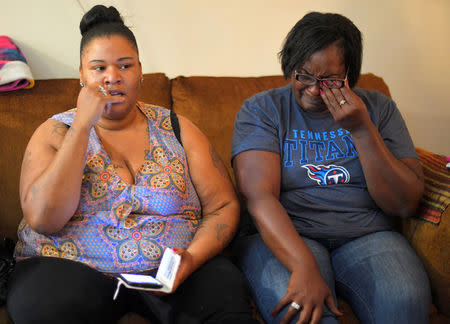 Natasha Nance (L) talks about the events the night her nephew, Tory, died as Quinta Sanders, Tory's mother, reacts in the living room of her home while speaking with Reuters in Nashville, Tennessee, U.S. October 10, 2017. REUTERS/Harrison McClary