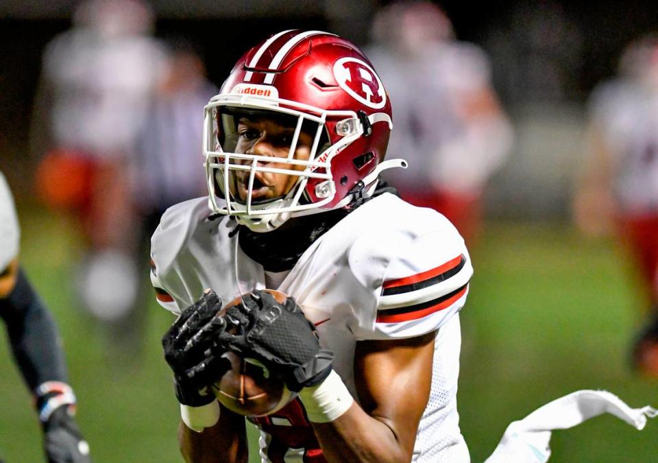 Warner Robins’ Cam Flowers (6) heads to the end zone for a touchdown after hauling in a deep pass during the Demons’ 31-28 overtime win at Creekside Friday night. 