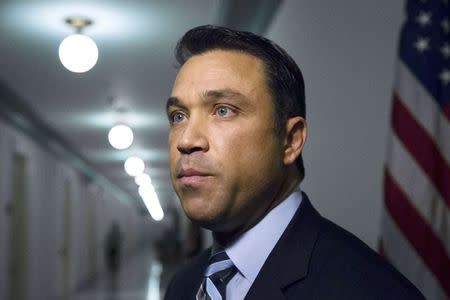 Representative Michael Grimm (R-NY) talks to reporters outside his office on Capitol Hill in Washington in this April 29, 2014 file photo. REUTERS/Jonathan Ernst/Files