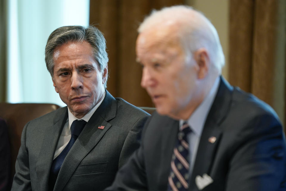 Secretary of State Antony Blinken listens as President Joe Biden speaks during a meeting with Colombian President Ivan Duque Marquez in the Cabinet Room of the White House, Thursday, March 10, 2022, in Washington. (AP Photo/Patrick Semansky)