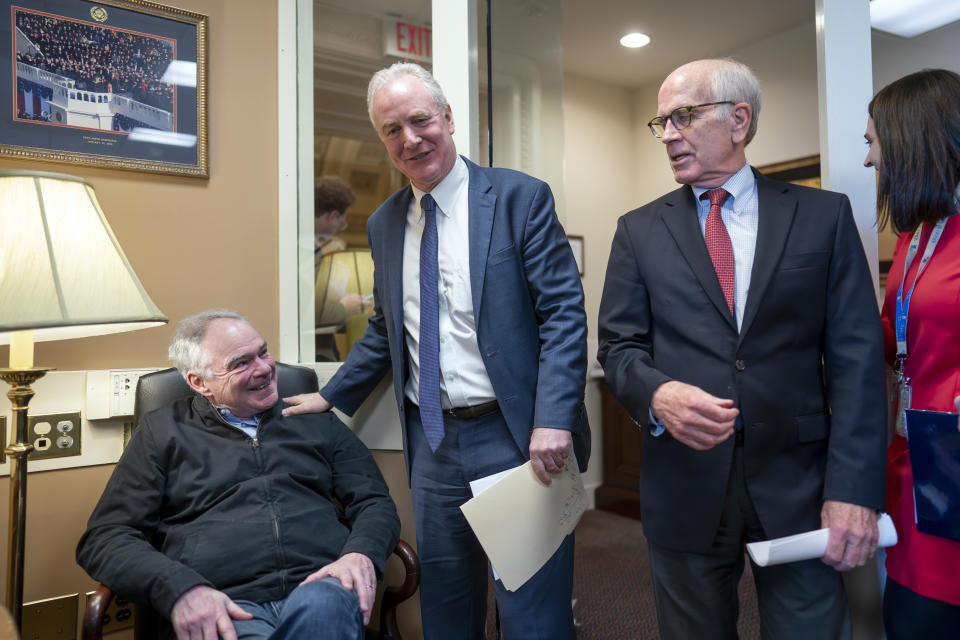 From left, Sen. Tim Kaine, D-Va., Sen. Chris Van Hollen, D-Md., and Sen. Peter Welch, D-Vt., meet before a news conference to discuss a national security memorandum with the Biden administration aimed at ensuring all weapons acquired through U.S. security assistance is used in line with international law, including international humanitarian law, at the Capitol in Washington, Friday, Feb. 9, 2024. (AP Photo/J. Scott Applewhite)