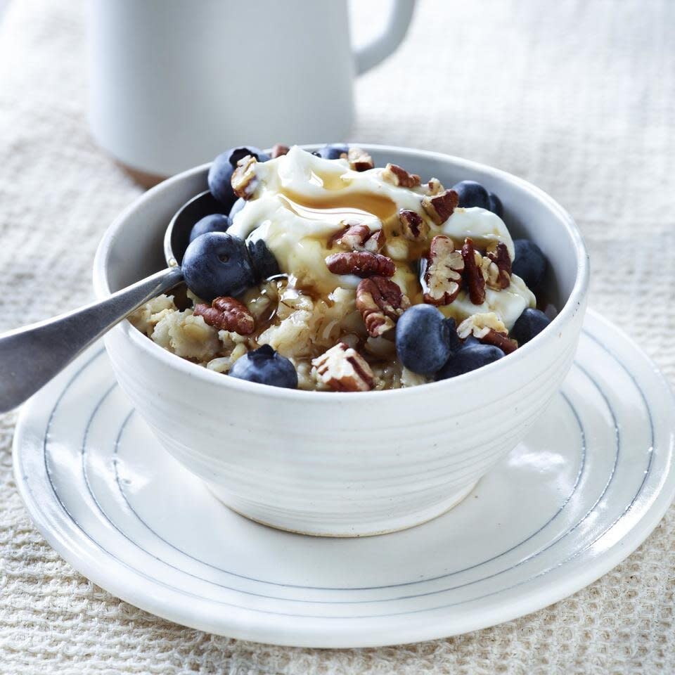 grain bowl with berries, yogurt and honey