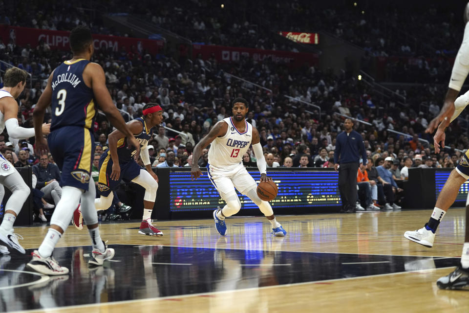 Los Angeles Clippers guard Paul George (13) drives to the basket during the second half of an NBA basketball game against the New Orleans Pelicans on Sunday, Oct. 30, 2022, in Los Angeles. (AP Photo/Allison Dinner)