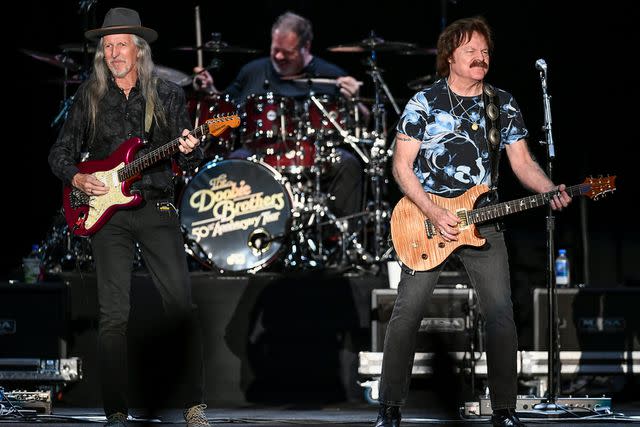 <p>Steve Jennings/Getty</p> Patrick Simmons and Tom Johnston of The Doobie Brothers performing on their 50th Anniversary Tour in Wheatland, California in October 2021