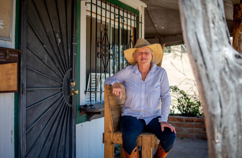 Jamie Bauer, a 69-year-old retiree, at the People Helping People humanitarian aid office, where she volunteers helping migrants in Arivaca, on April 15. (Photo: Eli Imadali for HuffPost)