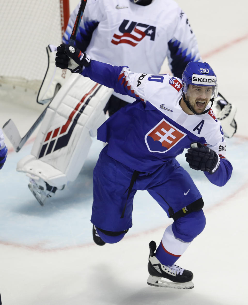 Slovakia's Tomas Tatar celebrates his sides fourth goal during the Ice Hockey World Championships group A match between Slovakia and the United States at the Steel Arena in Kosice, Slovakia, Friday, May 10, 2019. (AP Photo/Petr David Josek)