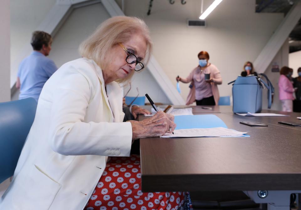 Bobbie Holsclaw, chair of the Jefferson County Board of Elections, signs paperwork to certify the election results for the county at the Election Center in Louisville, Ky. on June 30, 2020. 