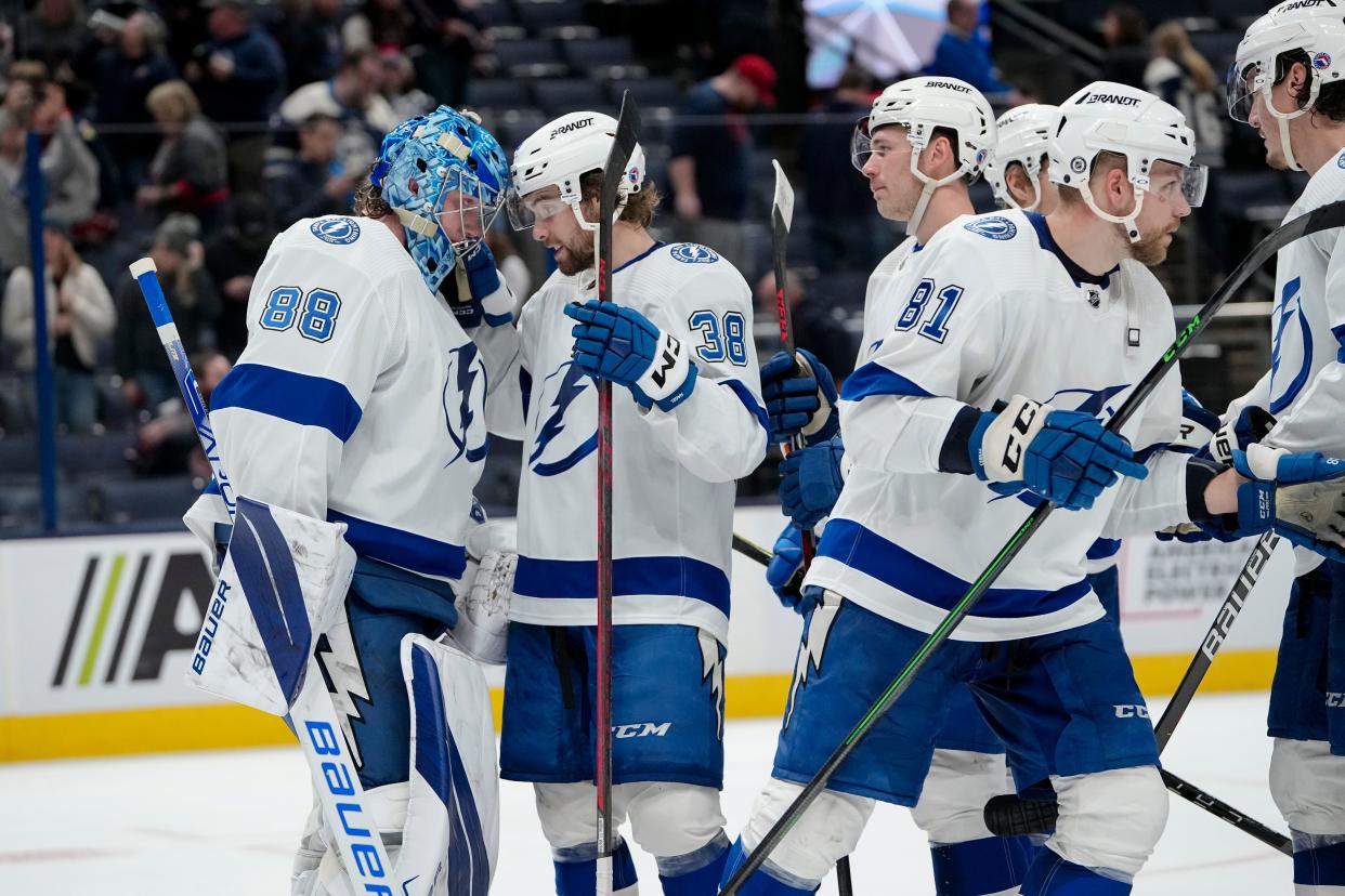 Oct 14, 2022; Columbus, Ohio, USA;  Tampa Bay Lightning left wing Brandon Hagel (38) congratulates goaltender Andrei Vasilevskiy (88) on their 5-2 win over the Columbus Blue Jackets in the NHL hockey game at Nationwide Arena. The Blue Jackets lost 5-2. Mandatory Credit: Adam Cairns-The Columbus Dispatch