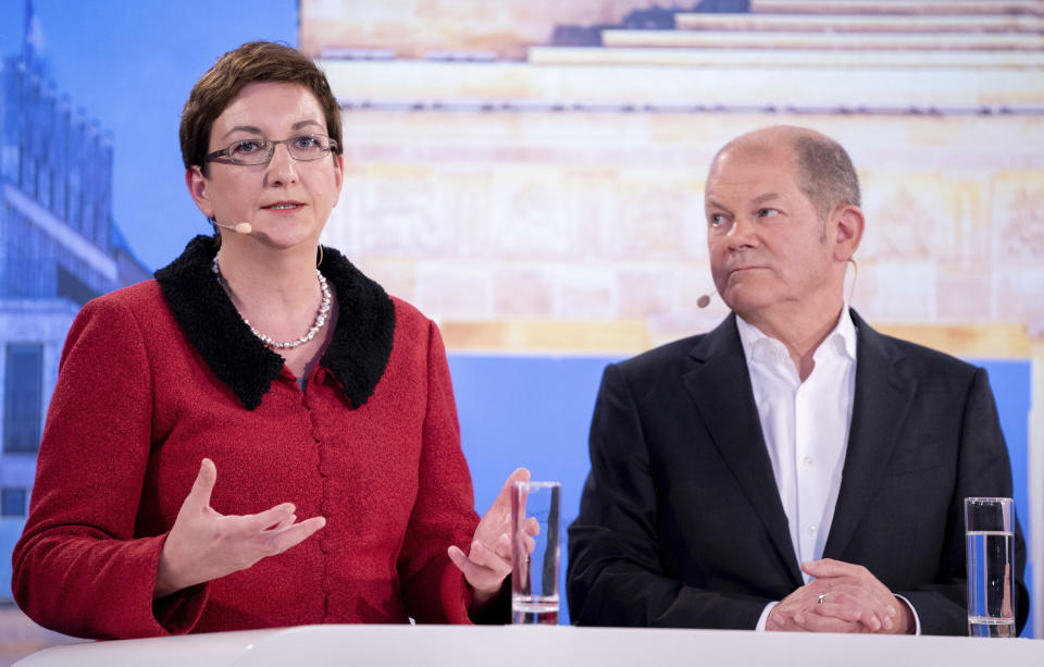File---Picture taken Nov. 18, 2019 shows Klara Geywitz, left, Olaf Scholz, the SPD's Federal Minister of Finance, the candidate duos for the SPD presidency, taking part in a TV duel organised by the editorial network Germany (RND) and Phoenix. (Kay Nietfeld/dpa via AP)