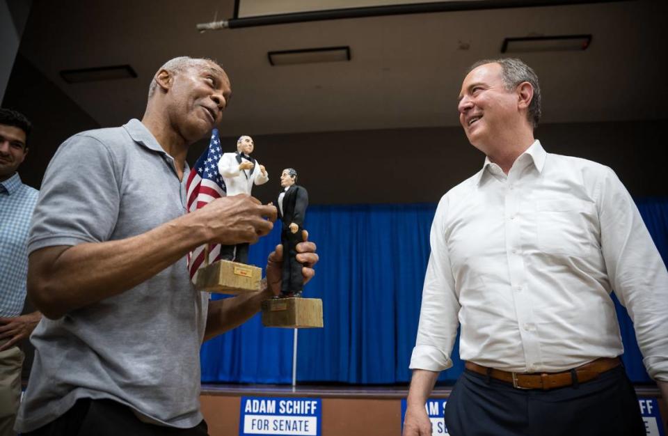 U.S. Rep. Adam Schiff, right, is presented with handmade figurines of himself and Maryland Democratic Rep. Jamie Raskin by Oak Park Army veteran Tony Carpenter after a town hall event hosted by the Women Democrats of Sacramento County on Aug. 4. “I made them during the impeachment (of former President Donald Trump),” Carpenter said.
