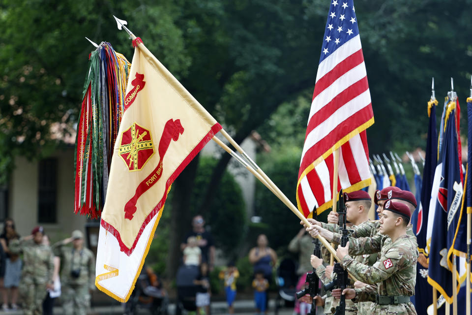 An honor guard displays the colors of Fort Bragg as a part of the ceremony to rename Fort Bragg, Friday, June 2, 2023 in Fort Liberty, N.C. The U.S. Army changed Fort Bragg to Fort Liberty as part of a broader initiative to remove Confederate names from bases. (AP Photo/Karl B DeBlaker)