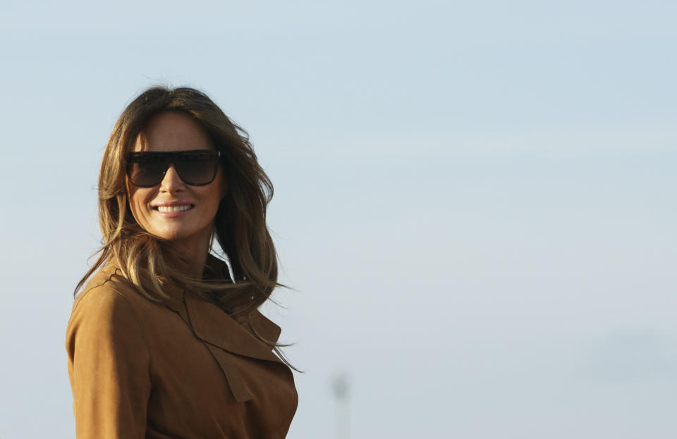 First lady Melania Trump boards a plane, Monday, Oct. 1, 2018, in Andrews Air Force Base, Md., en route to Africa. Melania Trump heads for Africa on her first big solo international trip, aiming to make child well-being the focus of a five-day, four-country tour. (AP Photo/Carolyn Kaster)