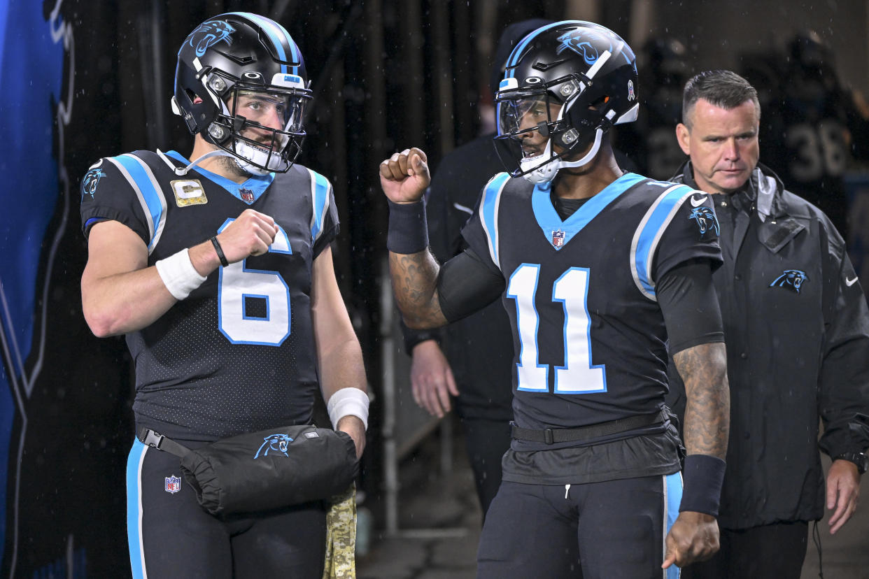 CHARLOTTE, NORTH CAROLINA - NOVEMBER 10: Baker Mayfield #6 of the Carolina Panthers and PJ Walker #11 of the Carolina Panthers talk before their game against the Atlanta Falcons at Bank of America Stadium on November 10, 2022 in Charlotte, North Carolina. (Photo by Grant Halverson/Getty Images)