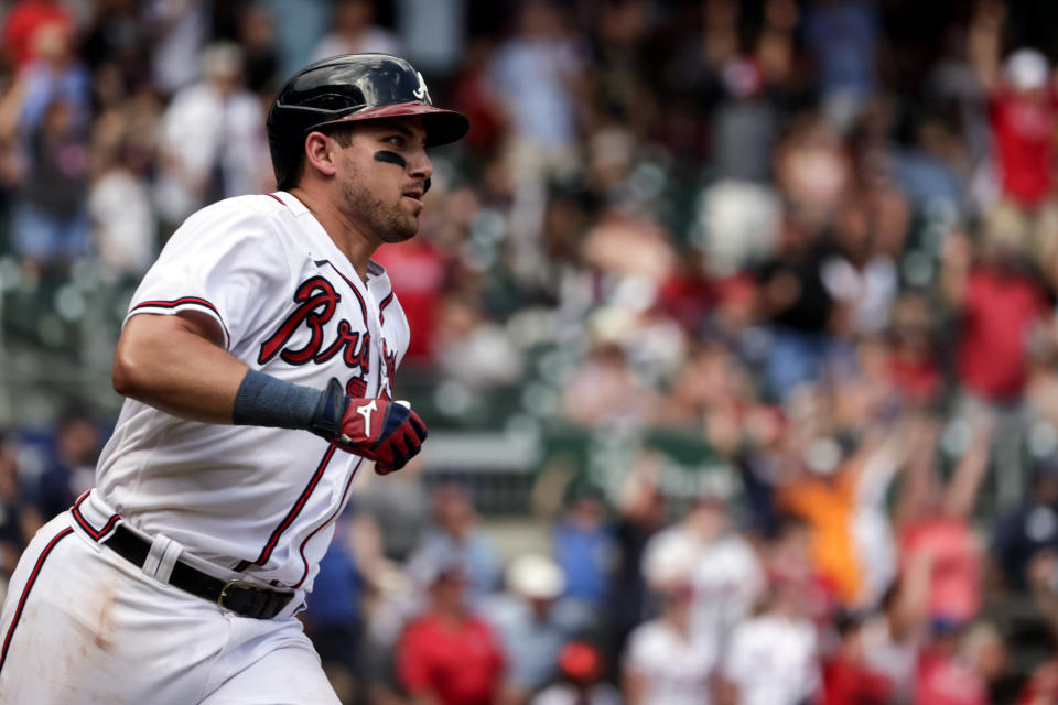 Atlanta Braves' Austin Riley runs to first on a game winning RBI during the ninth inning of a baseball game against the Arizona Diamondbacks, Sunday, July 31, 2022, in Atlanta. (AP Photo/Butch Dill)