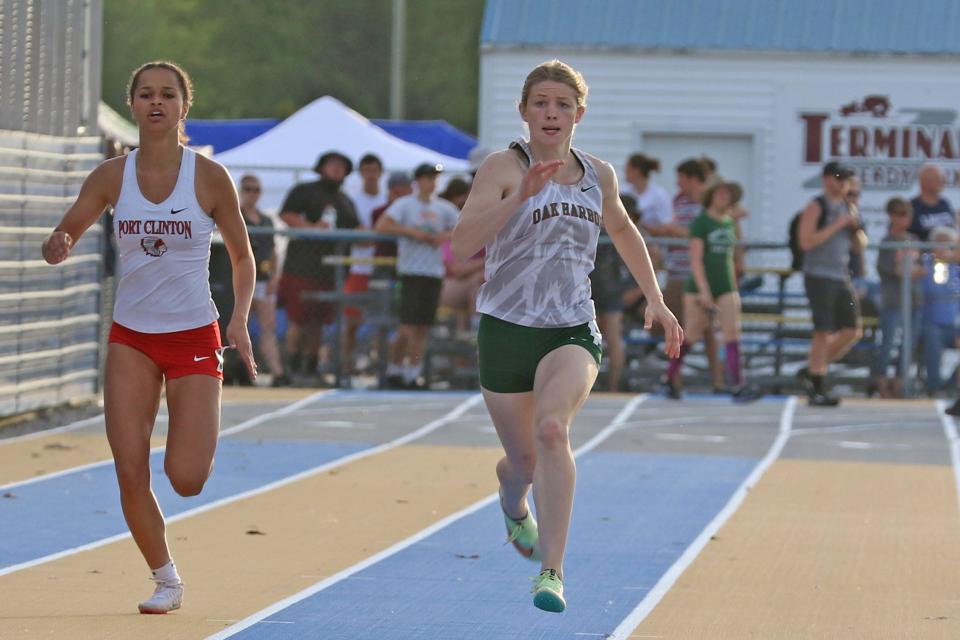 Port Clinton's Jade Mitchell, left, along with Oak Harbor's Rylee McKitrick in the 200.