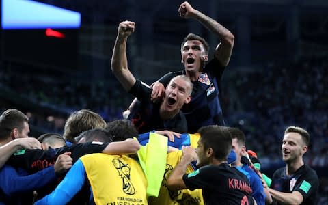 Croatia players celebrate euphorically after the final whistle - Credit: REUTERS/Ivan Alvarado