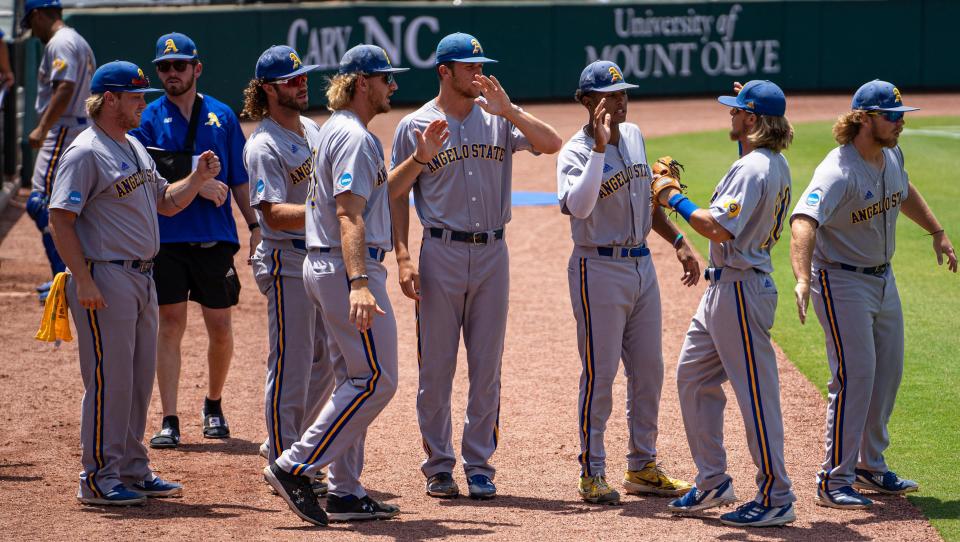 The Angelo State University baseball team celebrates during a win against Southern New Hampshire in the Rams' opening game of the D-II College World Series in Cary, North Carolina on Sunday, June 5, 2022.