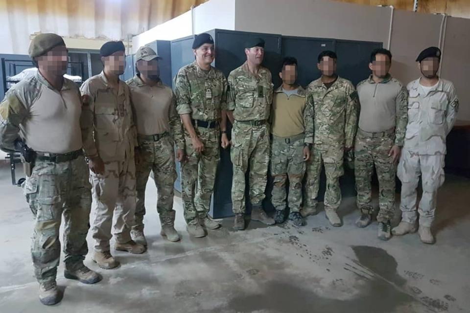 Triples members stand next to Vice Admiral Tim Frazer, then chief of joint operations (centre left), and General Patrick Sanders, now chief of the general staff (centre right) (Supplied)