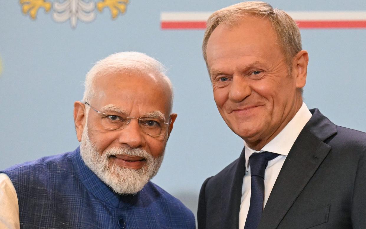 Donald Tusk, the Polish prime minister, and Narendra Modi, the Indian prime minister, pose for a photo after their meeting in Warsaw