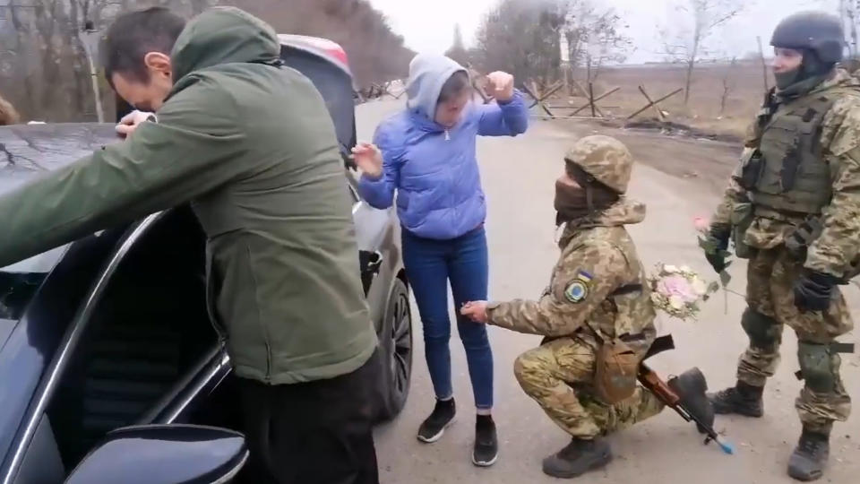 The woman was taken aback when the soldier dropped to one knee. Source: CEN/ Australscope