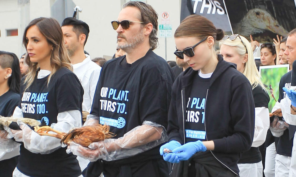 Joaquin Phoenix and Rooney Mara carry dead animals on a protest march (Credit: Getty)