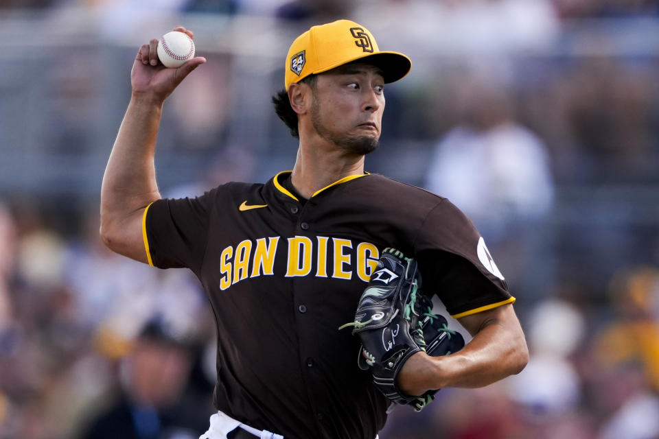 San Diego Padres starting pitcher Yu Darvish throws against the Seattle Mariners during the fourth inning of a spring training baseball game Sunday, March 3, 2024, in Peoria, Ariz. (AP Photo/Lindsey Wasson)