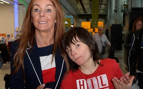 Charlotte Caldwell, with her 12 year son Billy at Heathrow Airport after arriving from Canada. Billy suffers from an extreme form of epilepsy, both he and Charlotte went to Canada to get access to a drug called canabis oil with is not available on the NHS and is deemed illgal in the UK. Charlotte had a six month supply of the medication but was confiscated by customs at Heathrow. - Credit: David Dyson