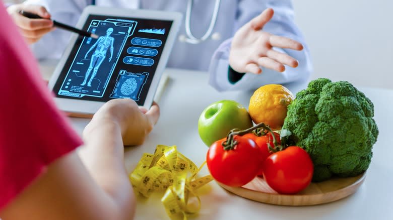 Doctor checking vitals digitally bowl food